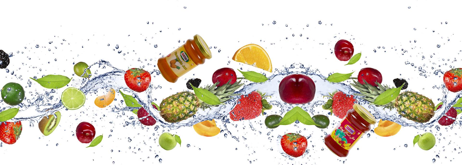 A Senthu jam jar among splashing fresh fruits
